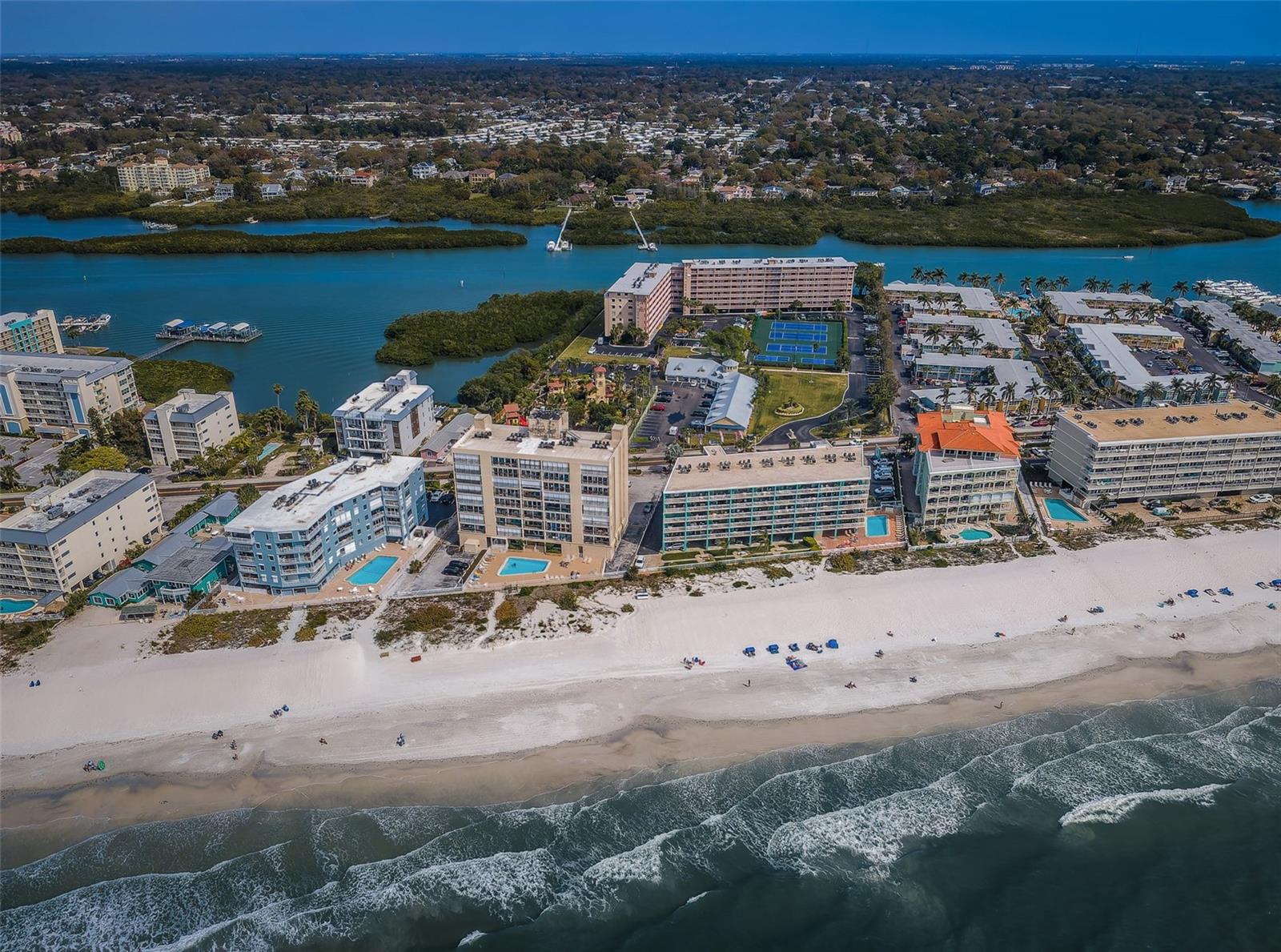 .. Indian Shores Florida Is Known To The Locals as  ' The Narrows ' Due To The Short Distance from the Intracoastal Waterway To The Beach. Here You Can See The Blue Tennis Courts of the Bay Shore Yacht & Tennis Club and The Beach Right Across the street.