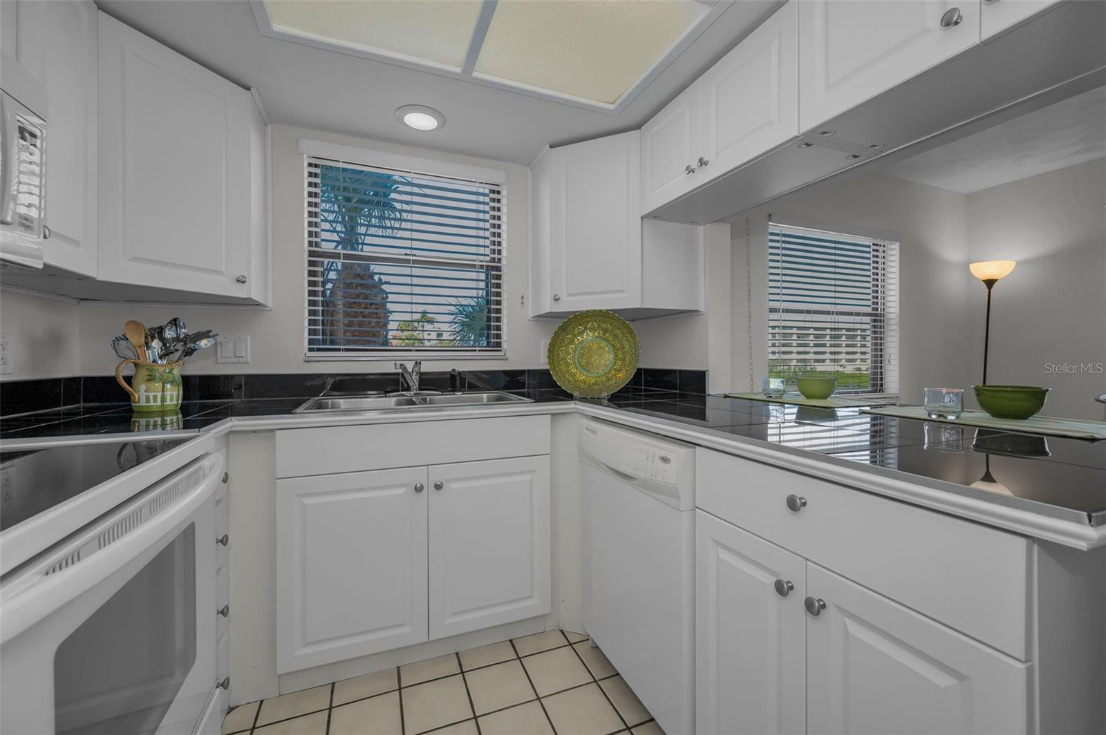 .. 12 X 8 Kitchen - Looking In.  Plenty of Natural Light. Breakfast Bar / Pass Thru on Right Side of Photo..