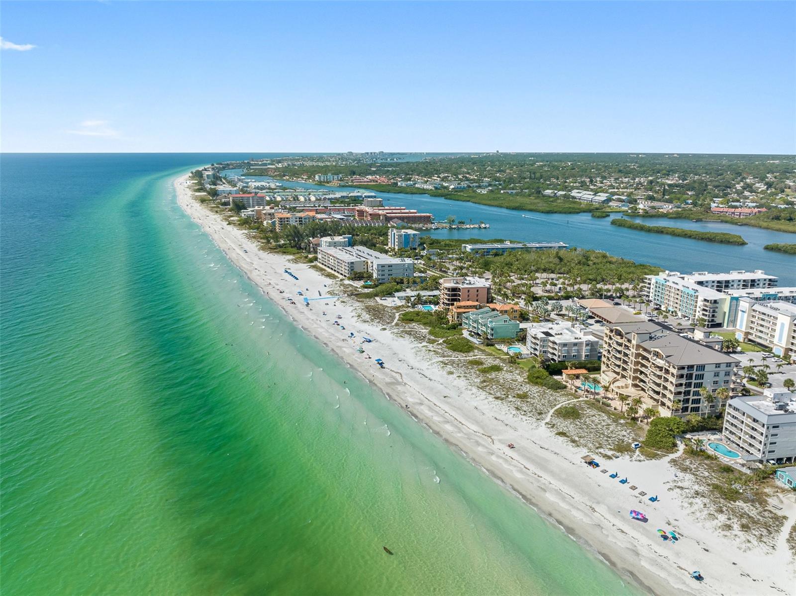 .. Indian Shores Florida Is Known To The Locals as  ' The Narrows ' Due To The Short Distance from the Intracoastal Waterway To The Beach. Here You Can See The Blue Tennis Courts of the Bay Shore Yacht & Tennis Club and The Beach Right Across the street.