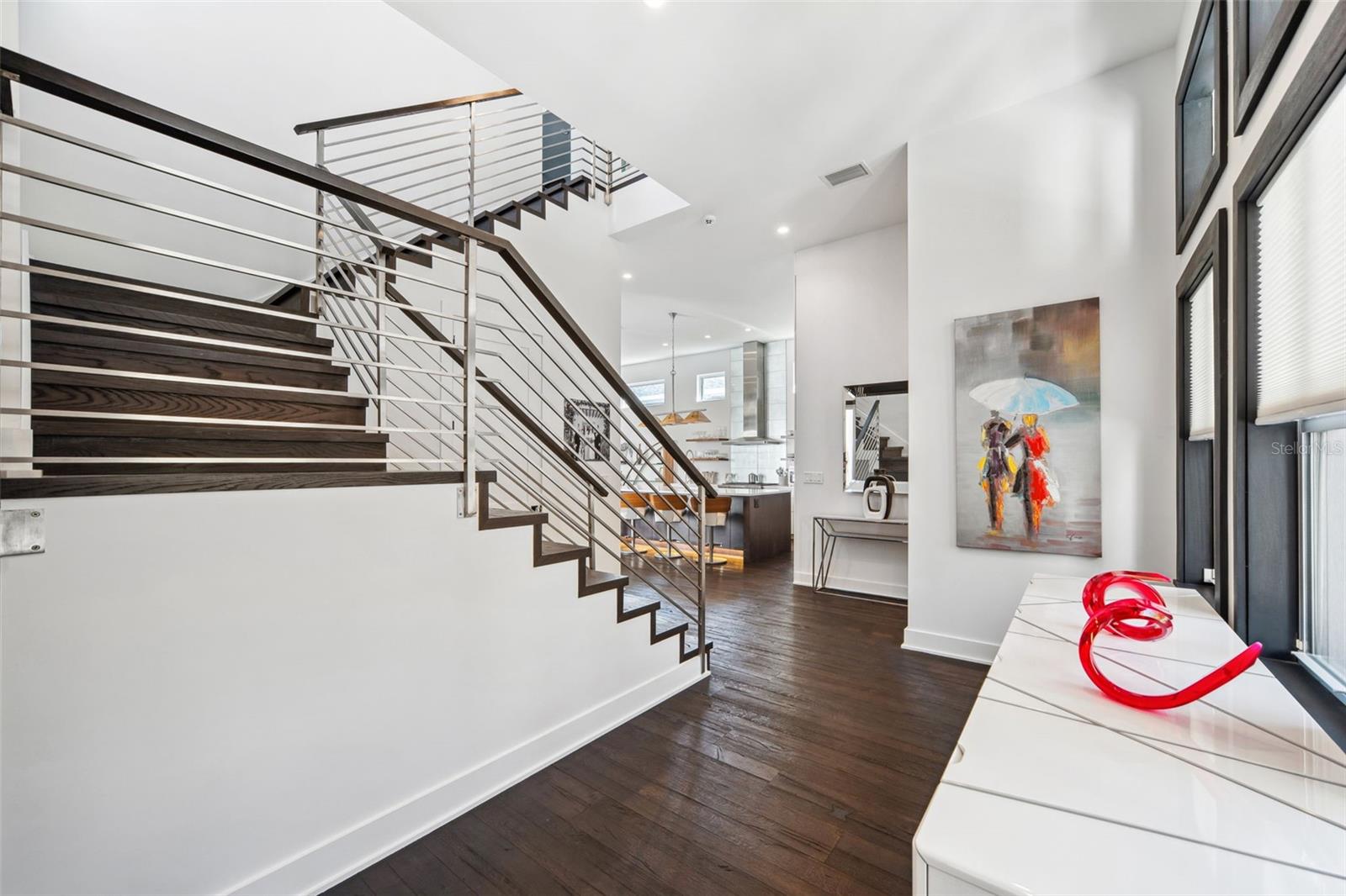 Welcoming foyer with elegant European oak flooring.