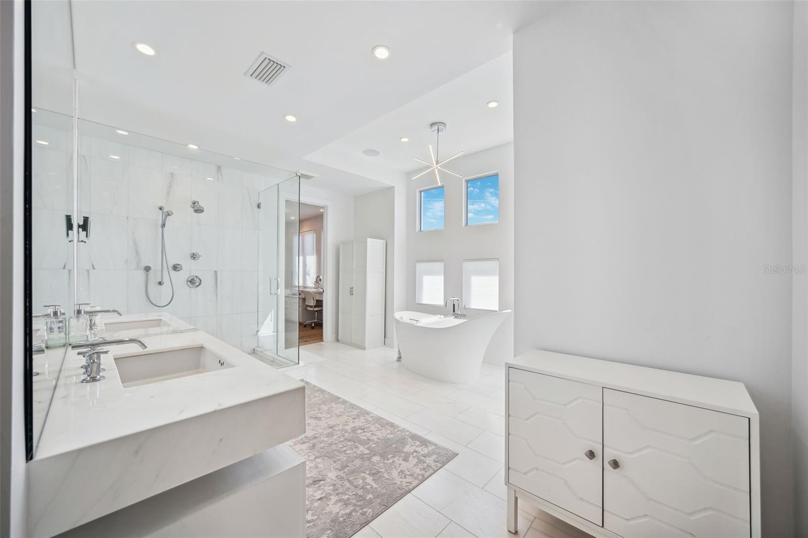 Gorgeous Primary ensuite bathroom features Italian marble flooring.