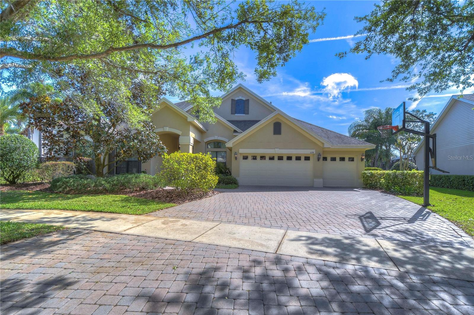 Nestled amid lush greenery, this charming four-bedroom home offers a perfect blend of comfort and elegance.