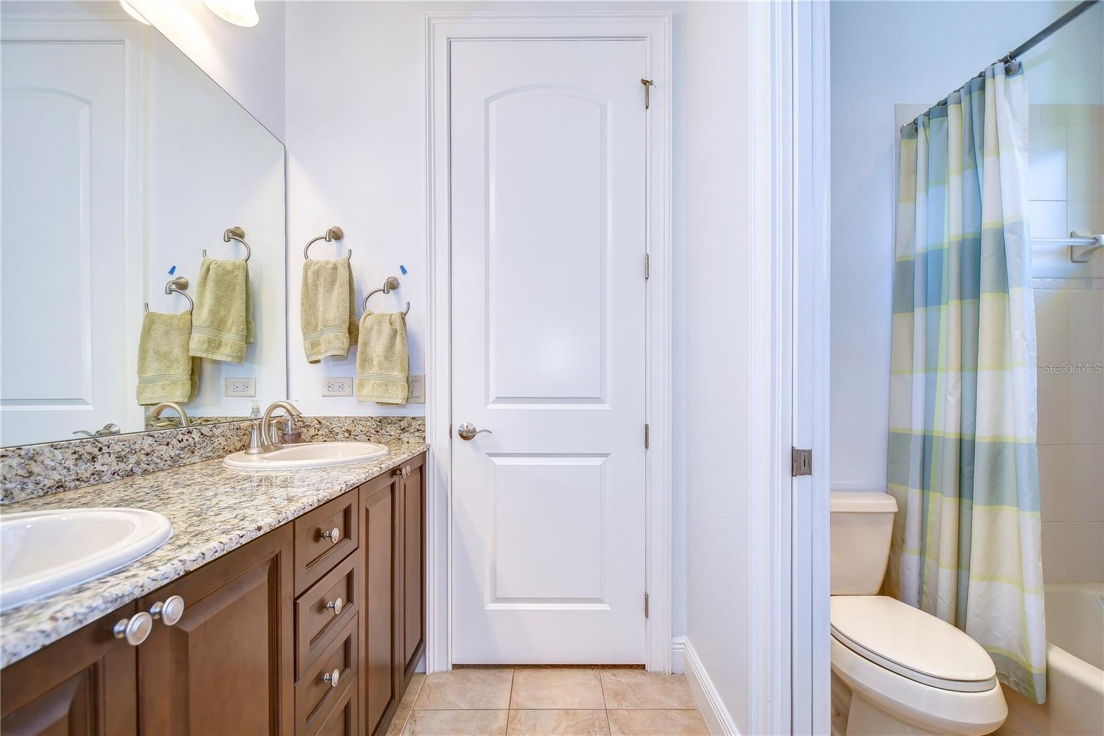 The tasteful tile accents and earthy tones make this space perfect for starting your day or unwinding at night