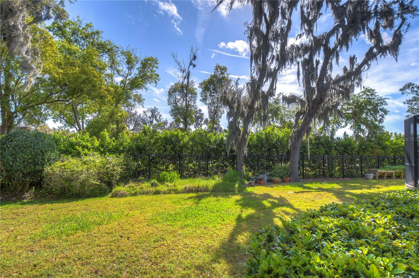 Embrace the Florida lifestyle with this beautifully landscaped backyard oasis, featuring a spacious screened lanai perfect for sun-drenched afternoons or starry evening gatherings.