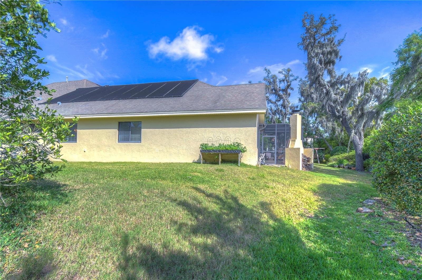 Lush greenery and mature greenery create a serene, private retreat in your own backyard.