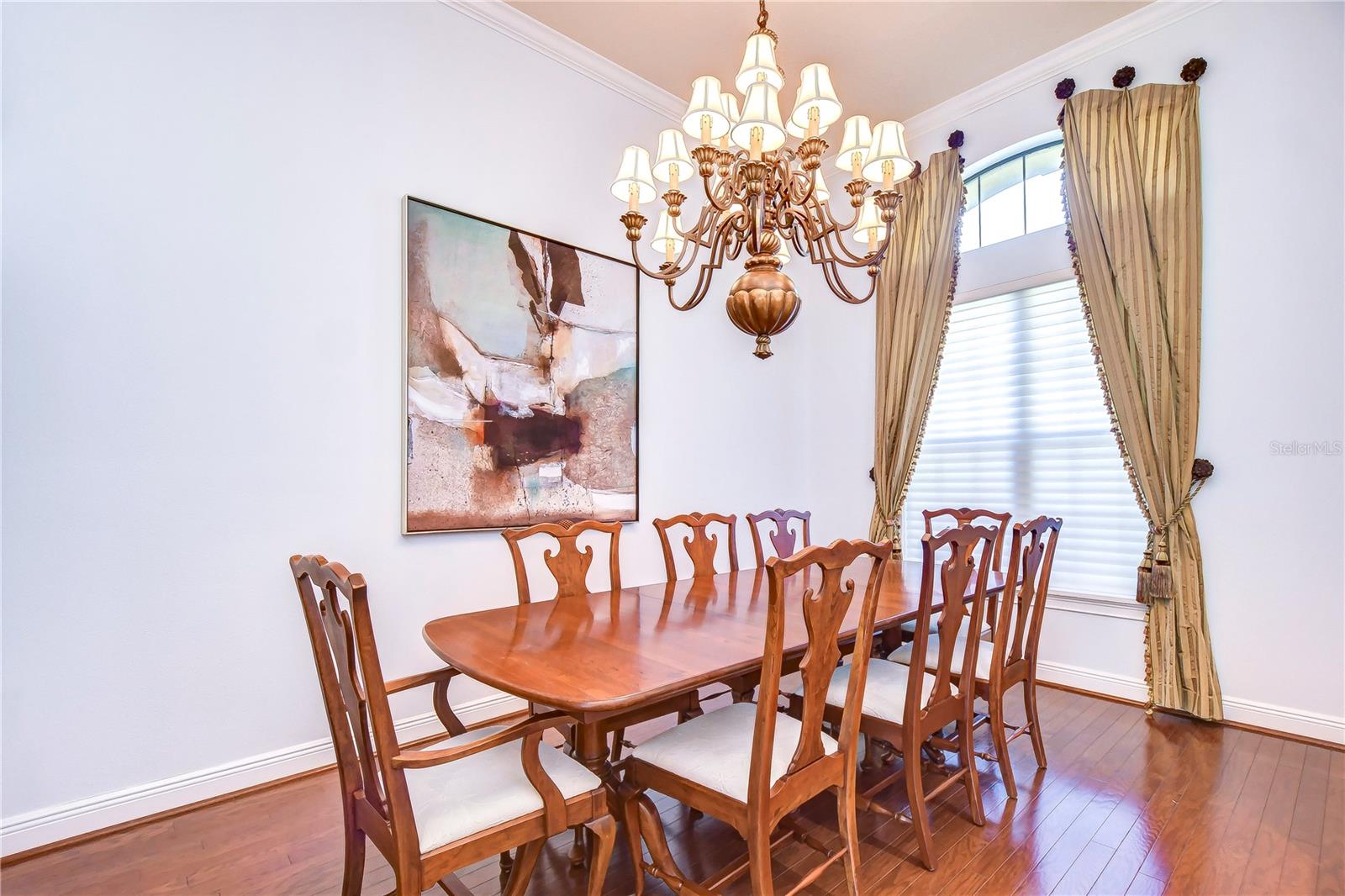 he gleaming hardwood floors guide you to dine in style beneath exquisite lighting.