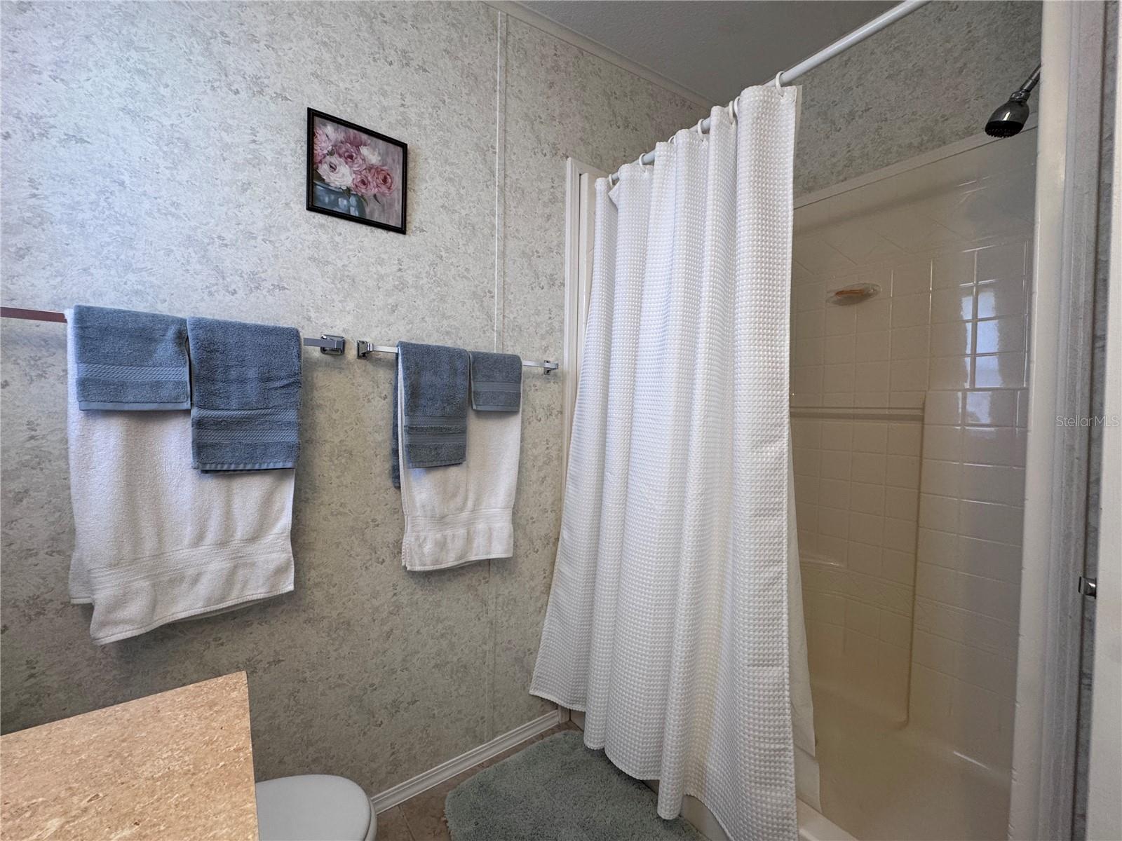 Primary bathroom with walk in shower.