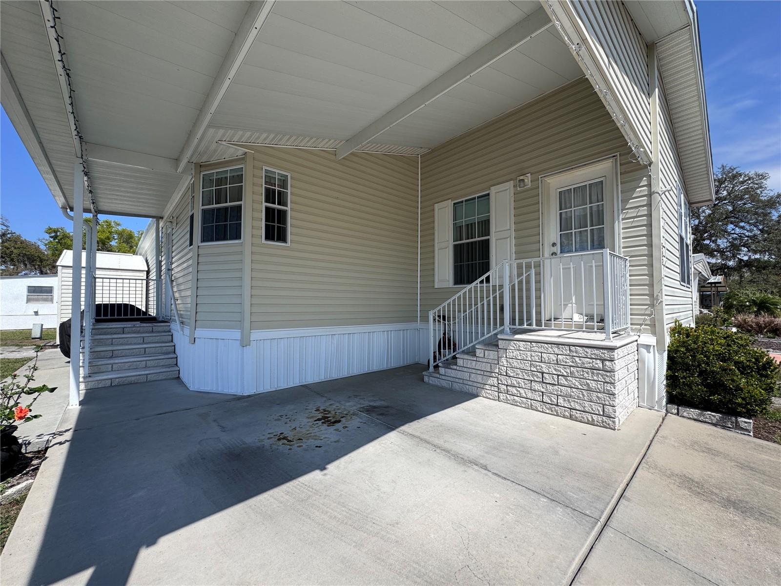 Carport with front door entrance.