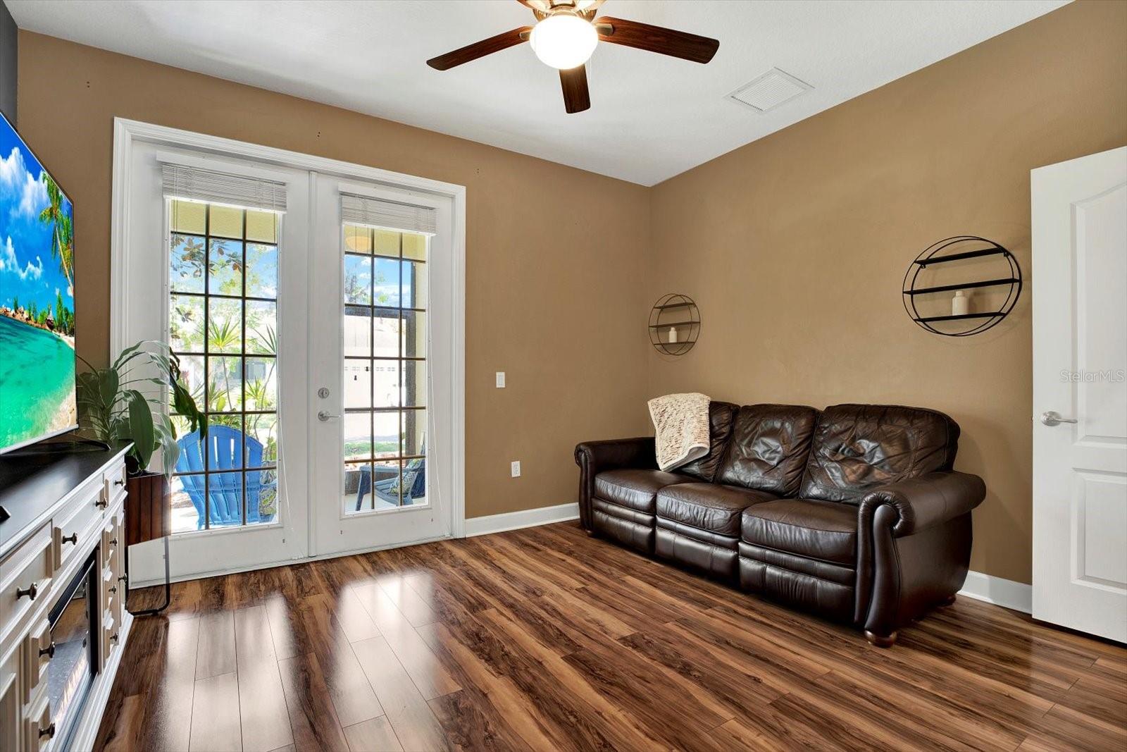 Walk through the french doors in bedroom 3 to the rear porch