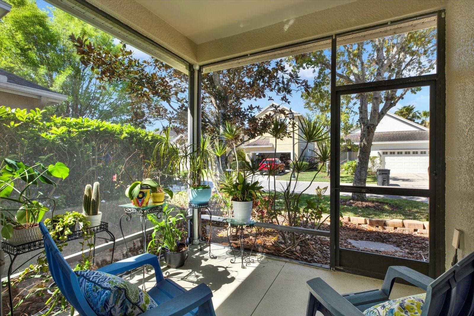 Rear screened in porch offers lots of privacy