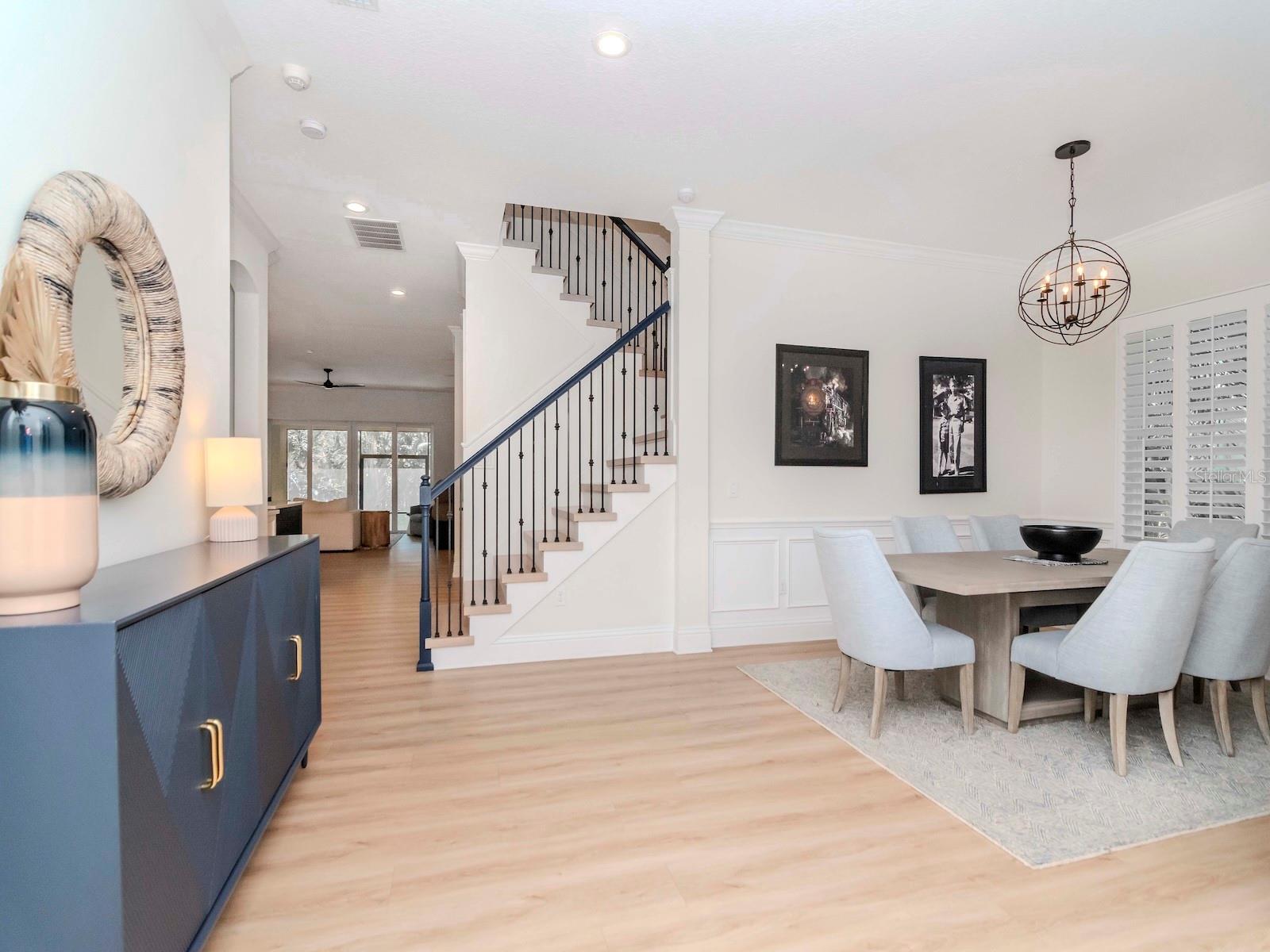 Open Foyer, modern lighting, wood shutters