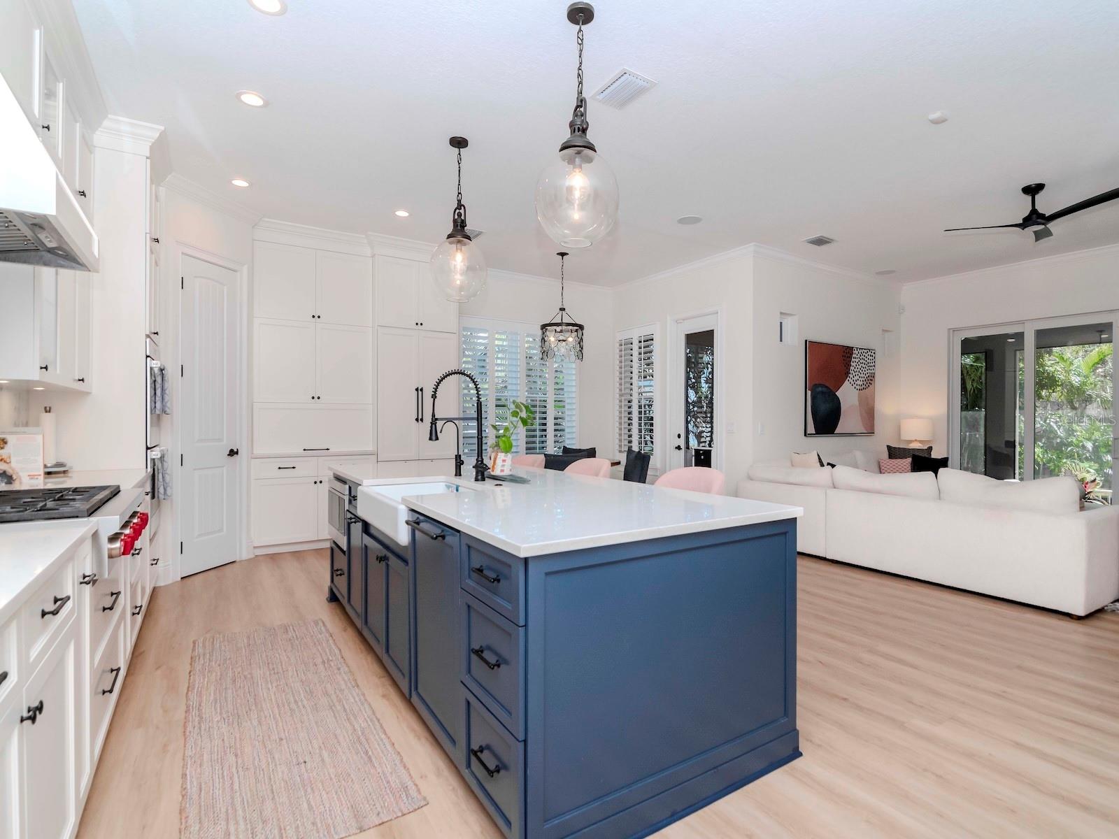 Open kitchen with quartz countertops, island