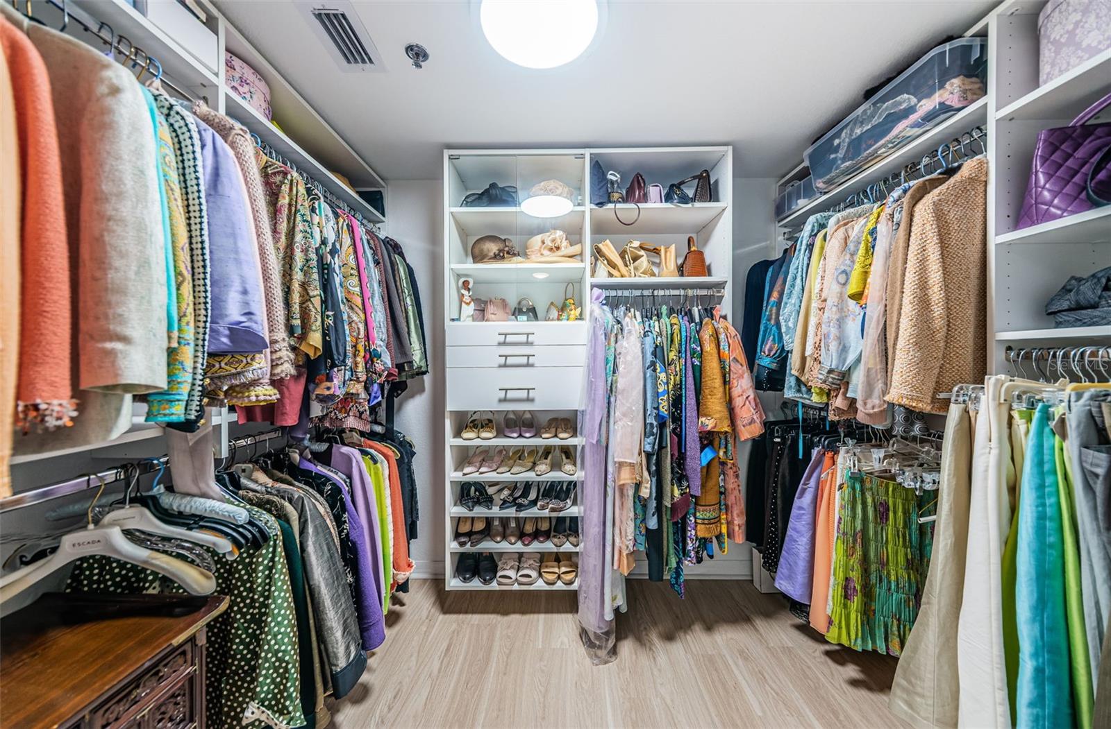 Large Walk In Closet featuring California System