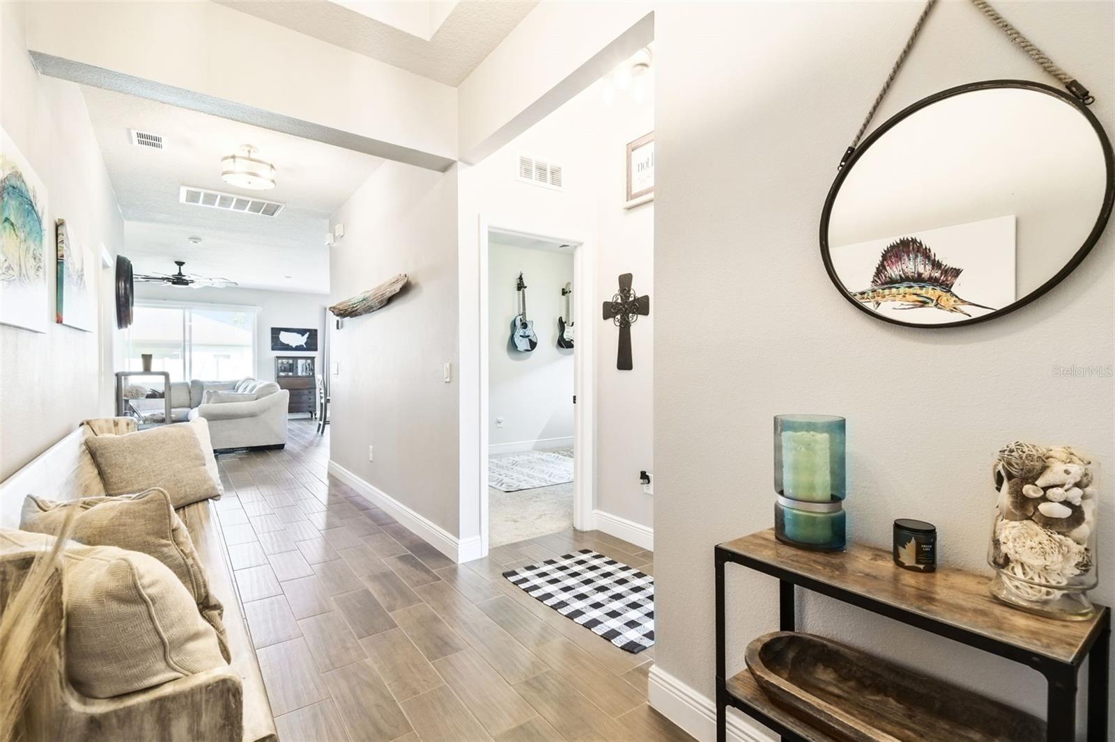 Foyer with a peek into secondary bedroom