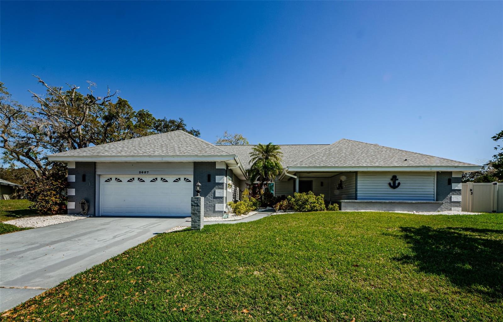 Another view of this large 4 bedroom 3 bath oversized 2-car garage situated on a large .55 acre lot.