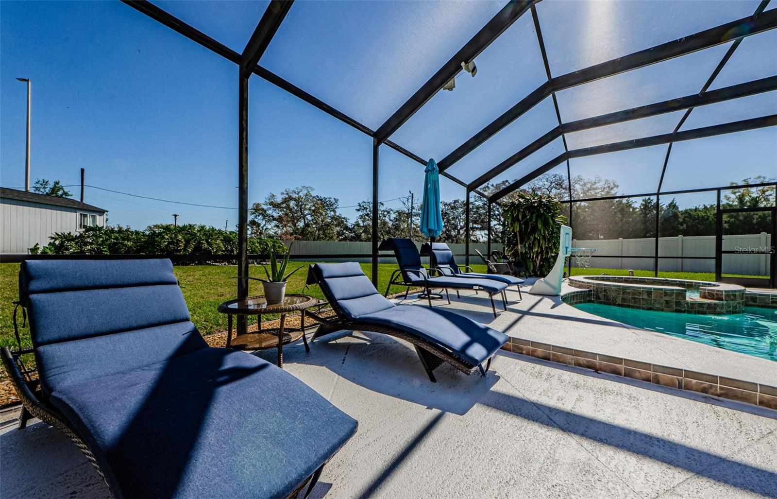 Lounge by the pool and spa.  All heated.  Beautiful led pool cage lights at night.