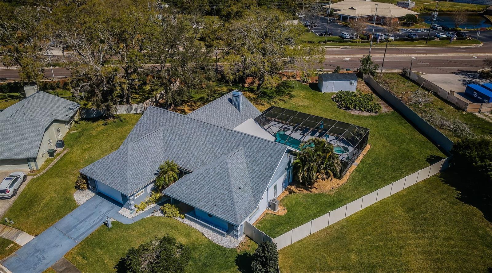 Ah, spectacular overhead shot of this large home, completely fenced with pool, and spa!  Way at the back, please note special shed, more details coming up!