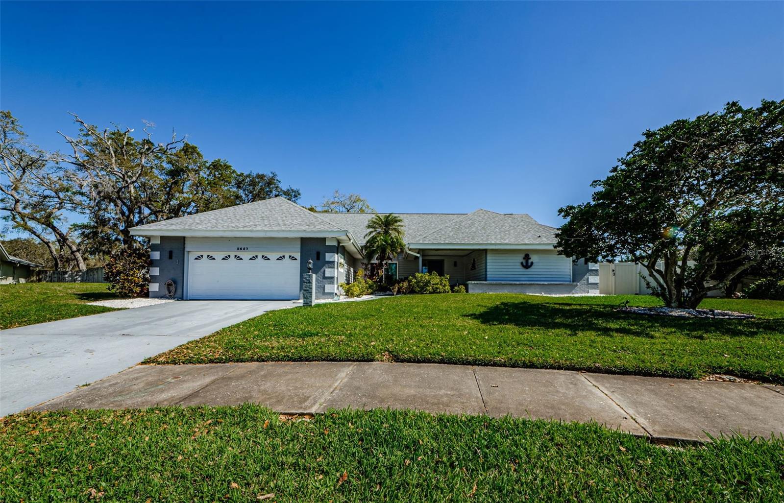 Gorgeous straight on view showing this home, with new roof, fresh exterior paint, with detail to cornices at all corners, new electrical panel, and new security home panels installed.