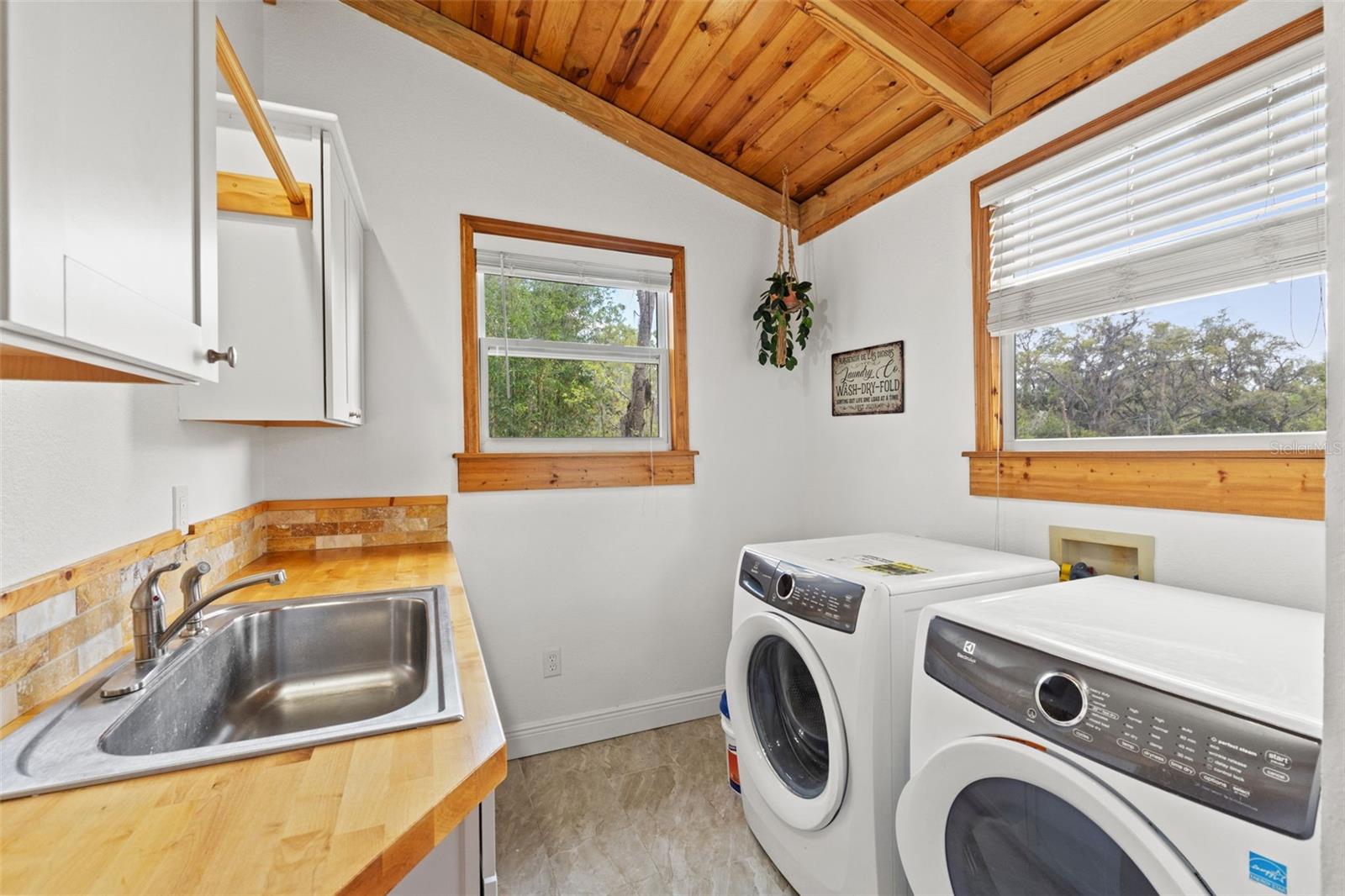 butcherblock counters and lofted laundry room