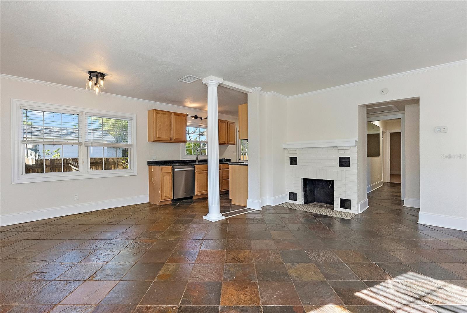 view from corner of dining room toward kitchen and sitting area.