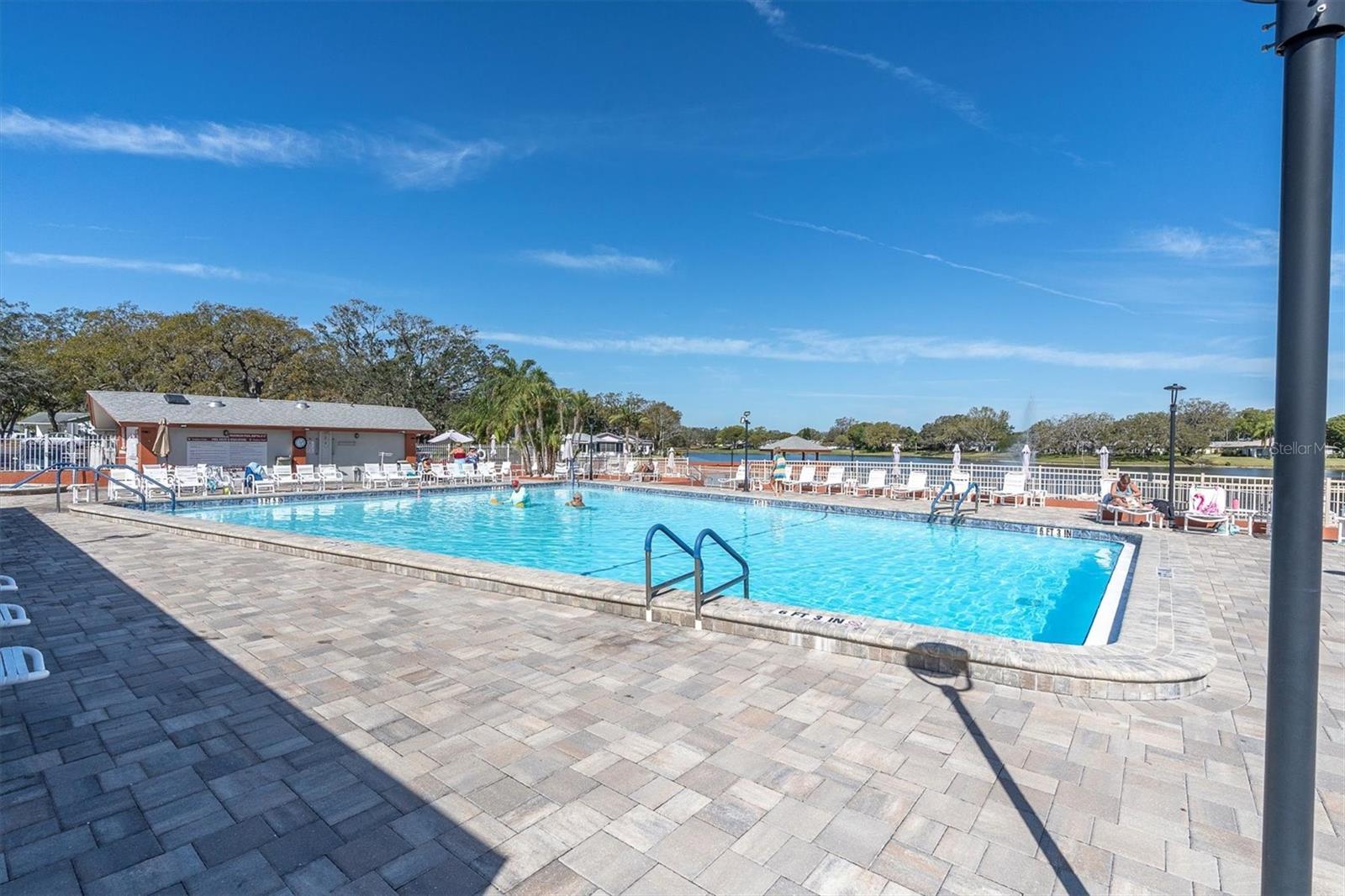 Community pool overlooking lake.