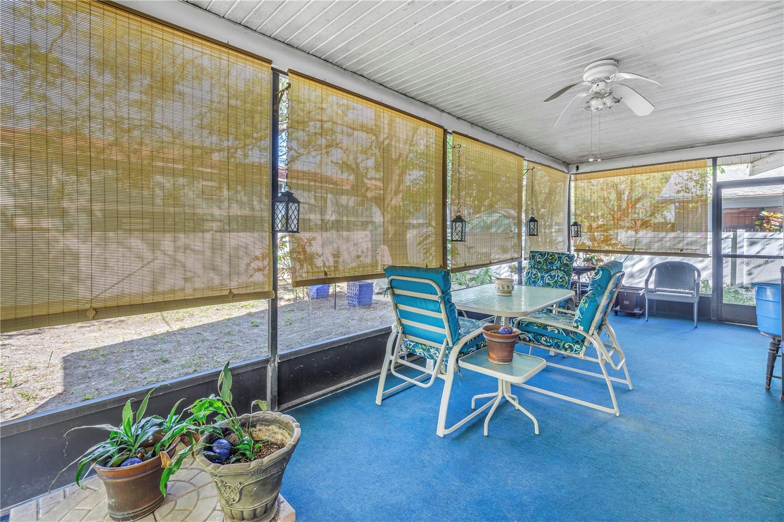 Large but cozy screened porch with blinds to block Western Sunset
