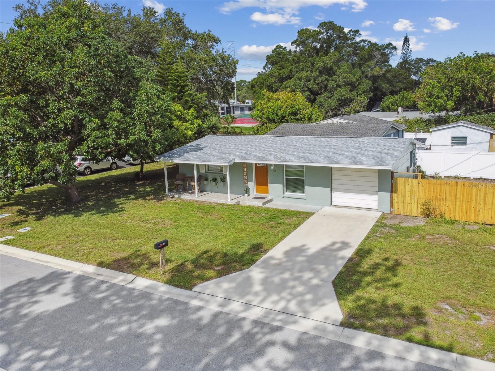 Spacious front and side yard with your own fruit bearing trees.