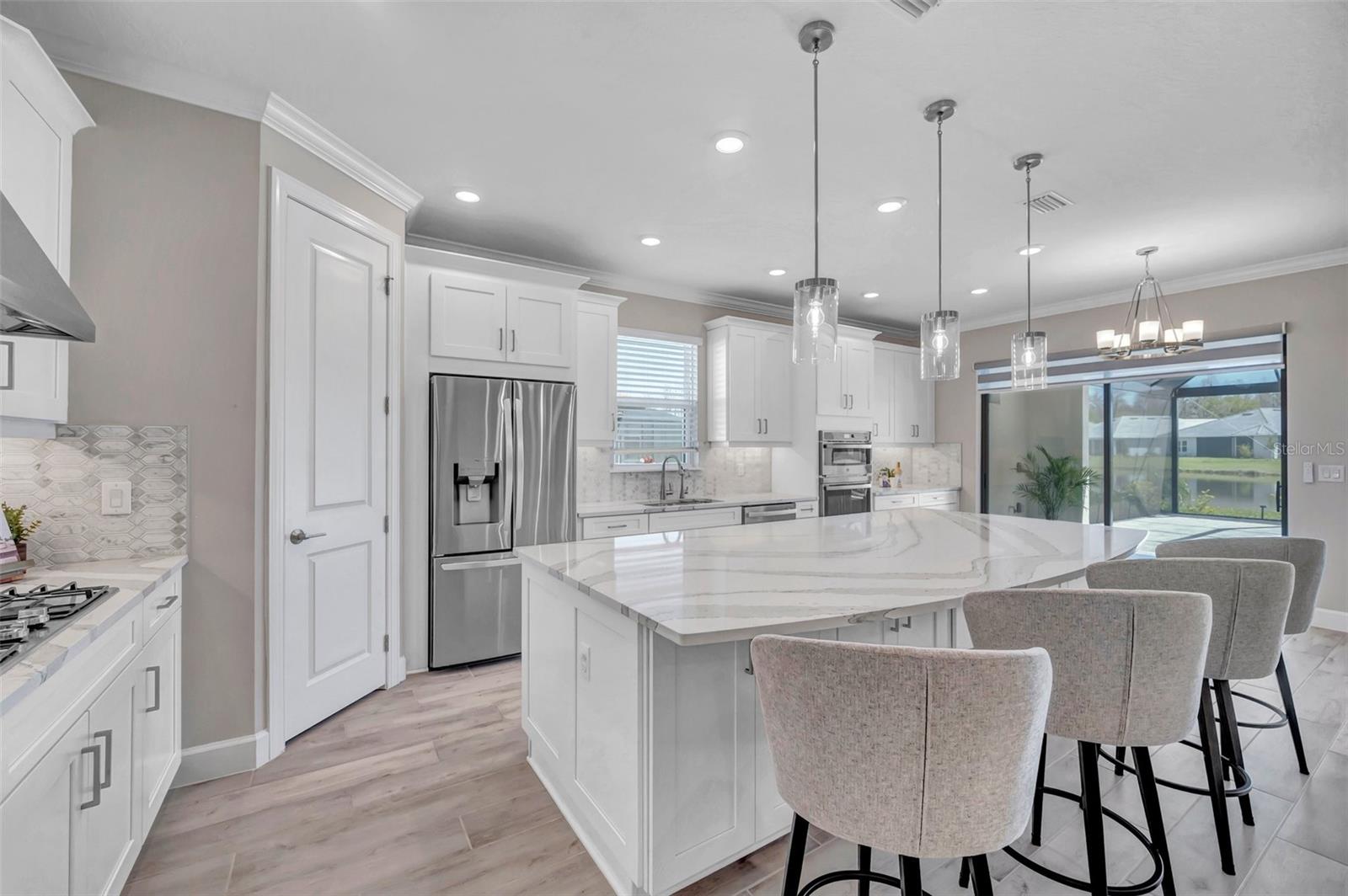 Gourmet Kitchen with Finished Cabinetry On Back of Island