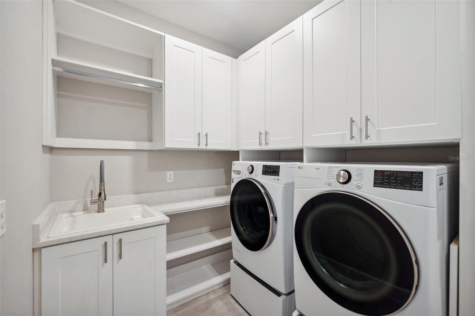 Laundry Room with Custom Cabinetry & Utility Sink