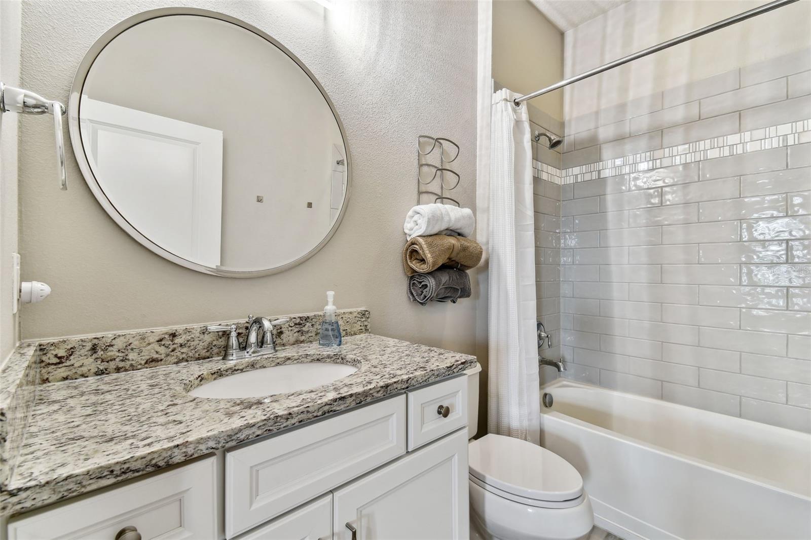 First floor guest bedroom with attached bath