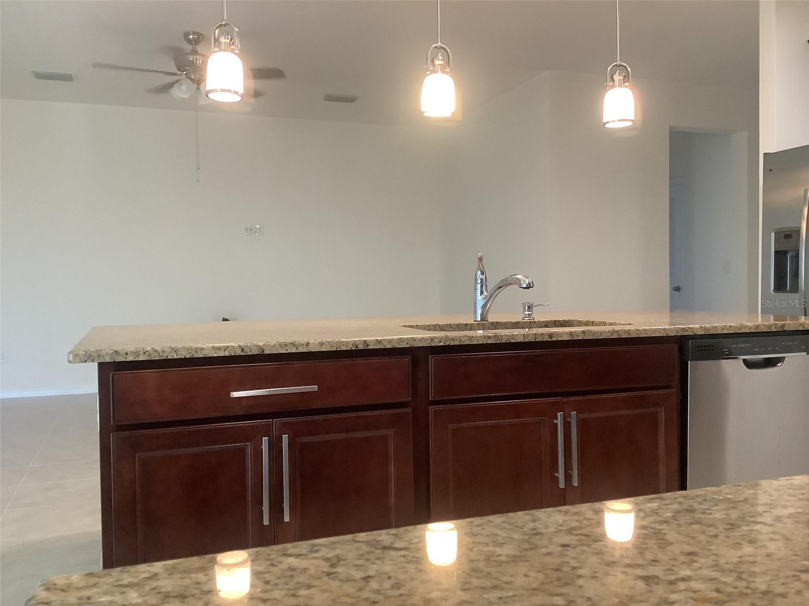 Looking towards Family room from kitchen Large under counter storage cabinets