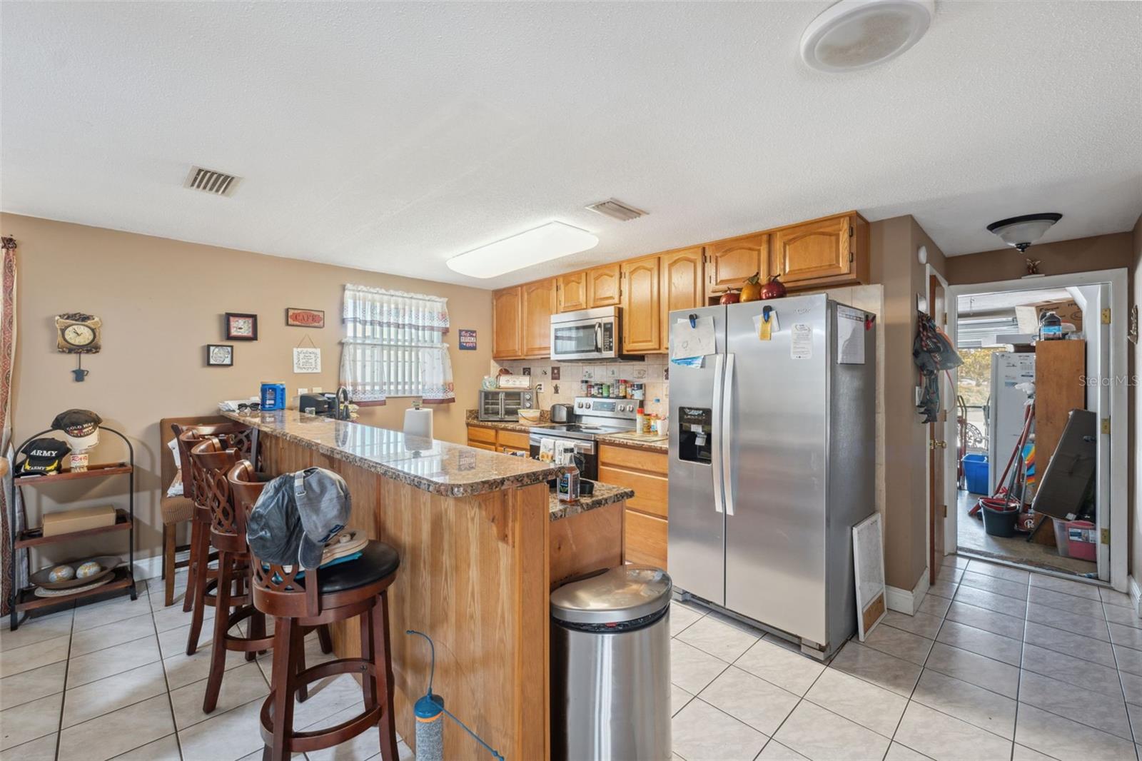 Kitchen with wood cabinets and granite counters