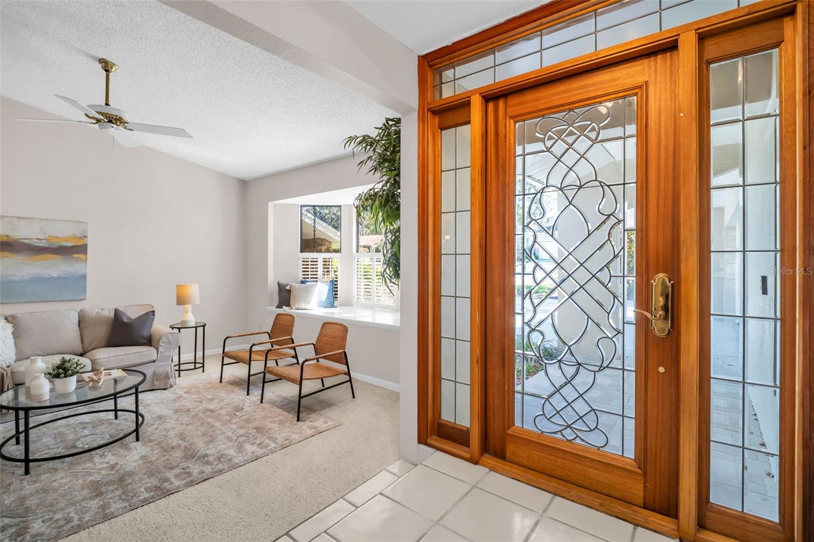 Gracious front entry greeted by soaring vaulted ceilings~