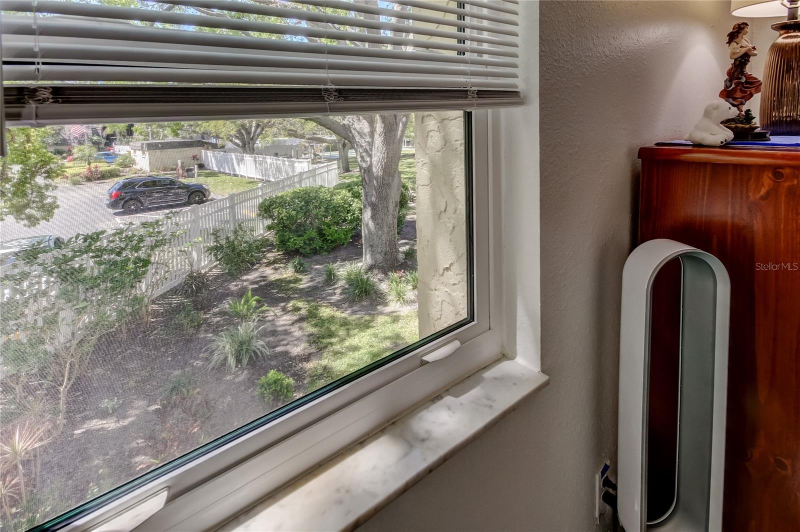 All windows, including this master bedroom window, are hurricane impact windows