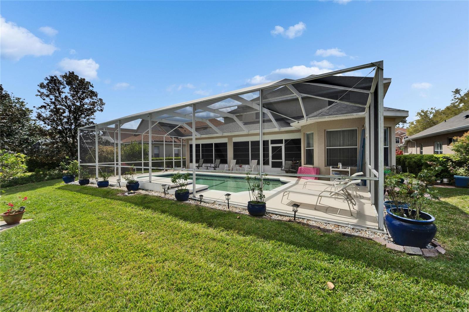 Living the dream! Nice back yard, and a heated pool.