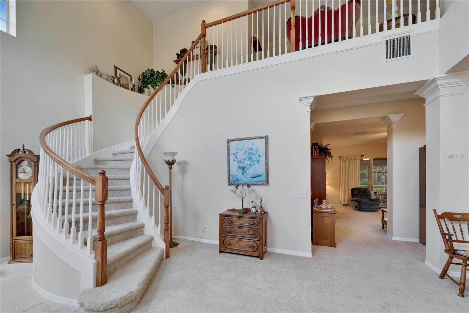 The spiral staircase leads to a large loft that is a magnificent transition area of the home.  Four bedrooms upstairs