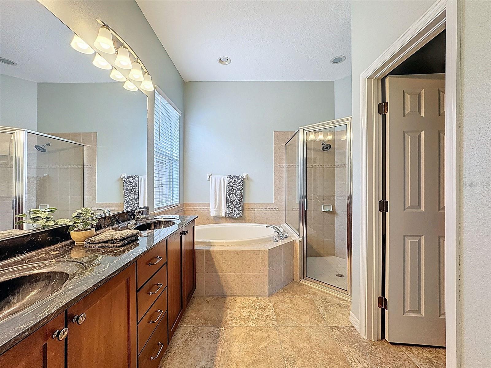 GARDEN SOAKING TUB, DUAL VANITIES AND SEPARATE PRIVATE COMMODE