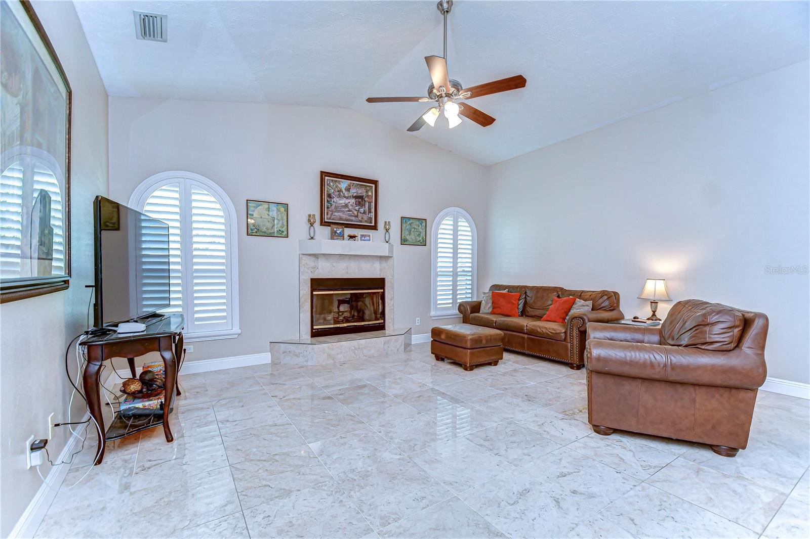 Step into this elegantly appointed living room where timeless charm meets modern comfort.