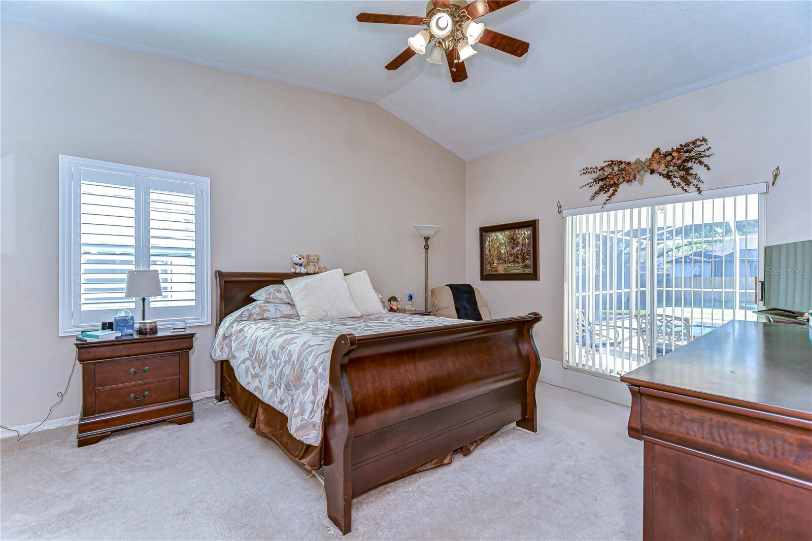 Step into tranquility in this inviting primary bedroom, where bright natural light meets elegant design.