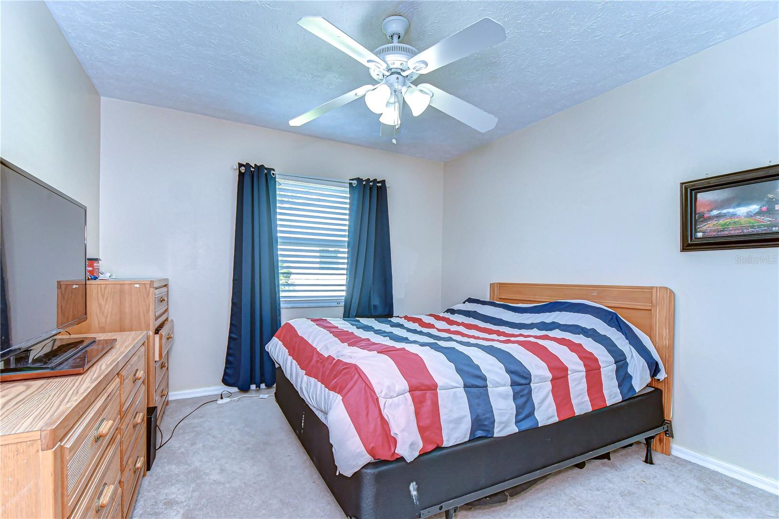 The bedroom offers ample room for relaxation or binge-watching your favorite shows.