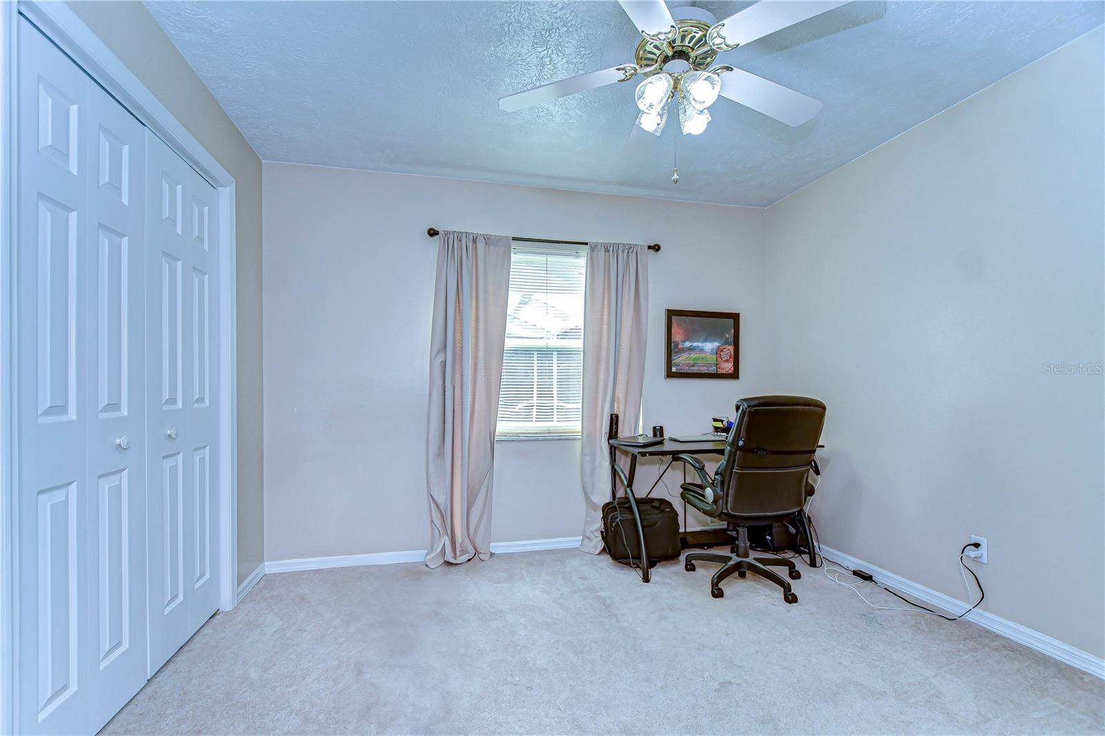 With ample closet space and a serene atmosphere, this bedroom is perfect for a home office or cozy retreat