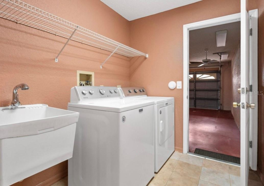 Washer and Dryer in the inside laundry room do stay with the home, Notice the sink too !!