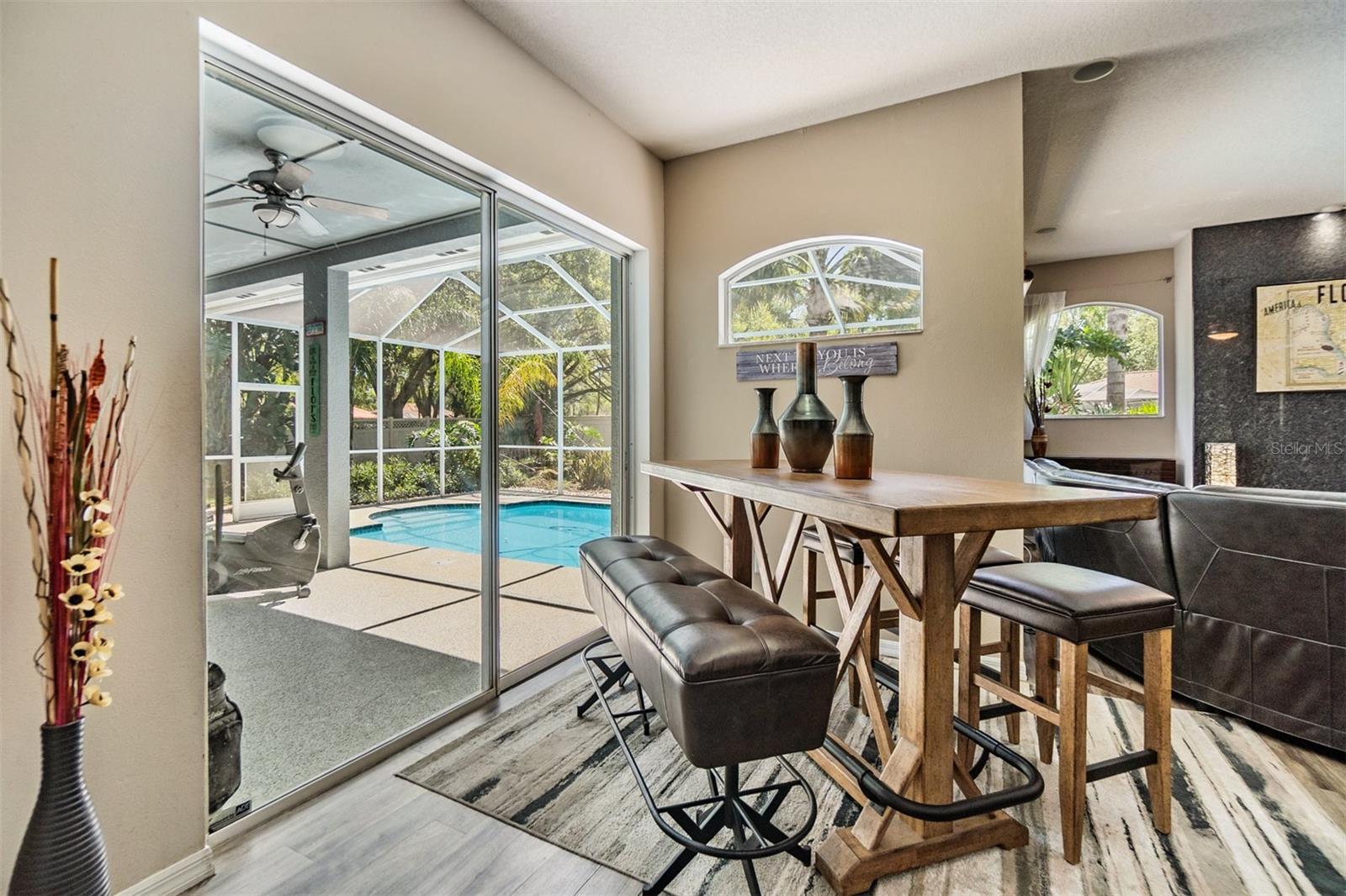 Dinette table overlooking pool and lanai.