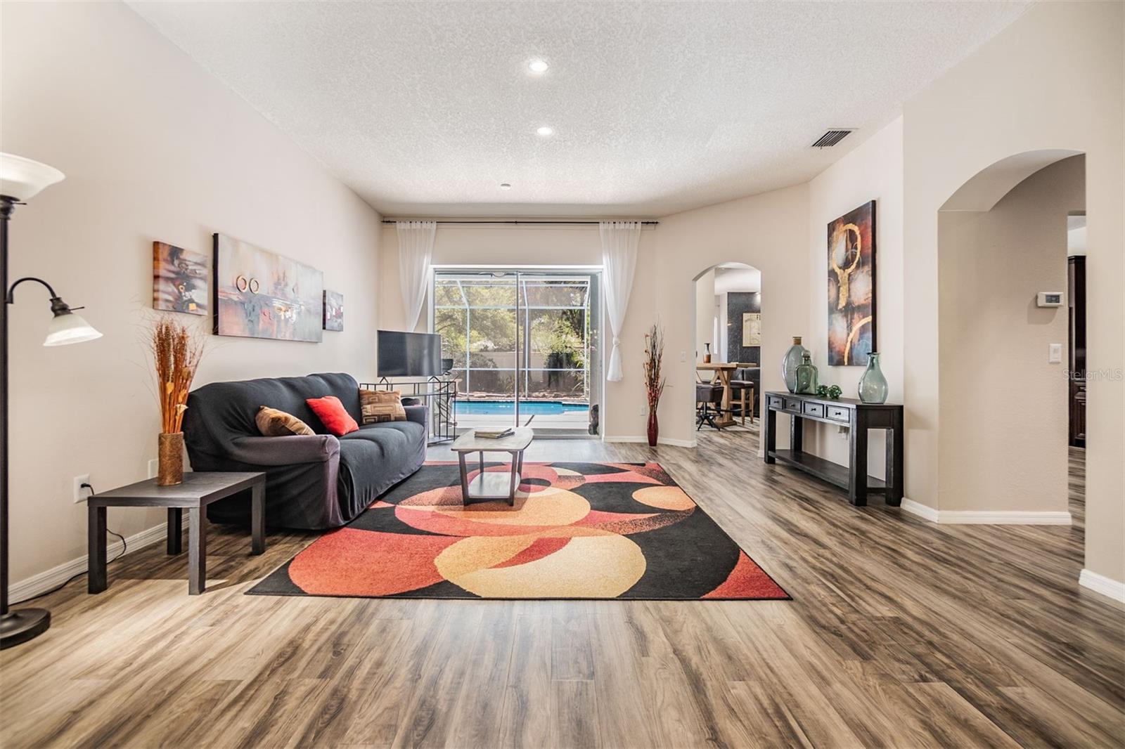 Formal Living Room, Laminate Flooring open to the pool/lanai.