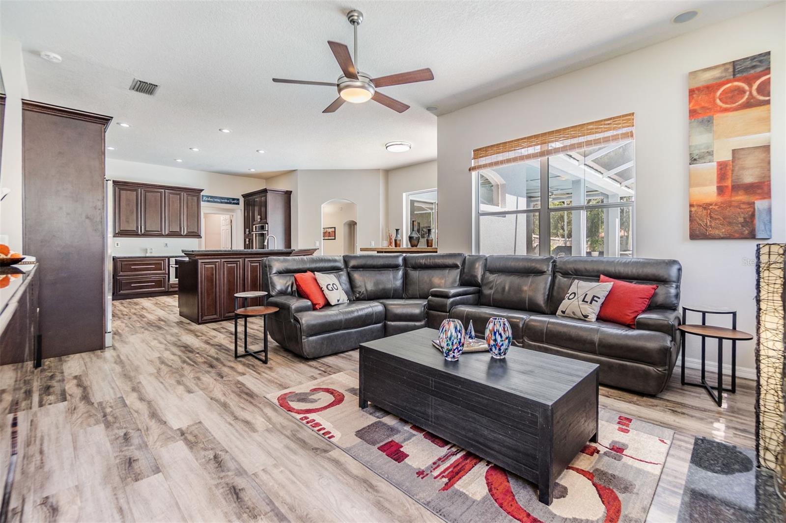 Family Room, Laminate Flooring, Ceiling Fan and Fireplace.