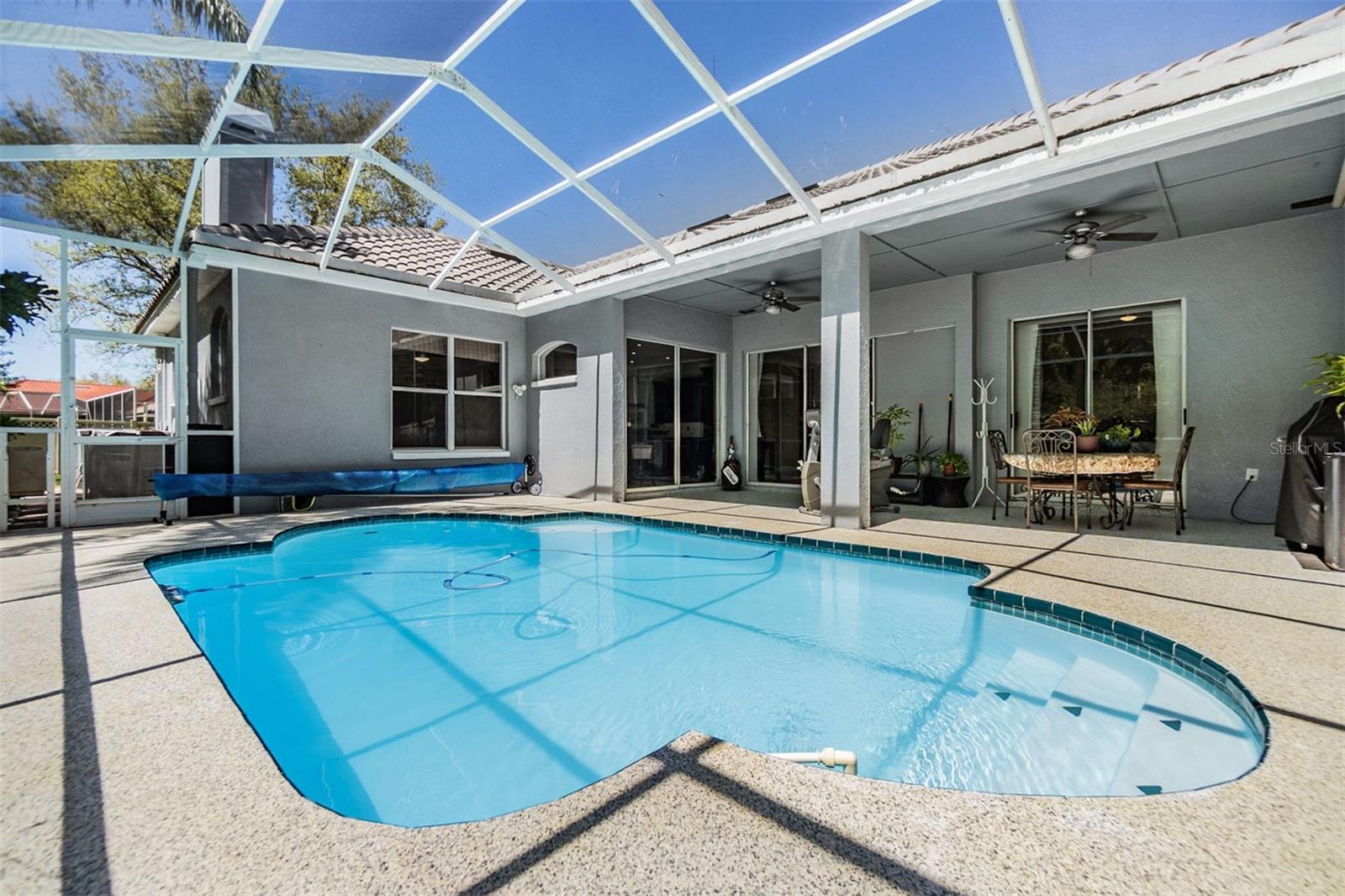 Pool/Lanai with Pool cover and roller