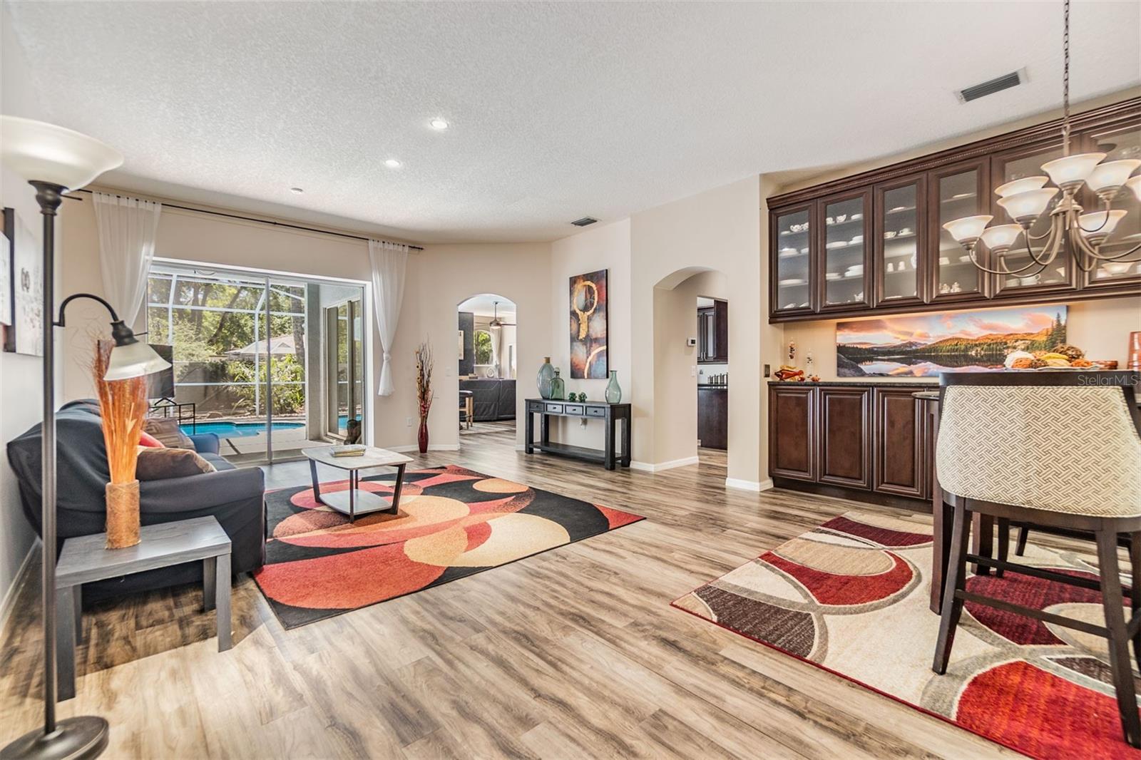 Entry Way, Dining Room and Living Room overlooking the pool and lanai