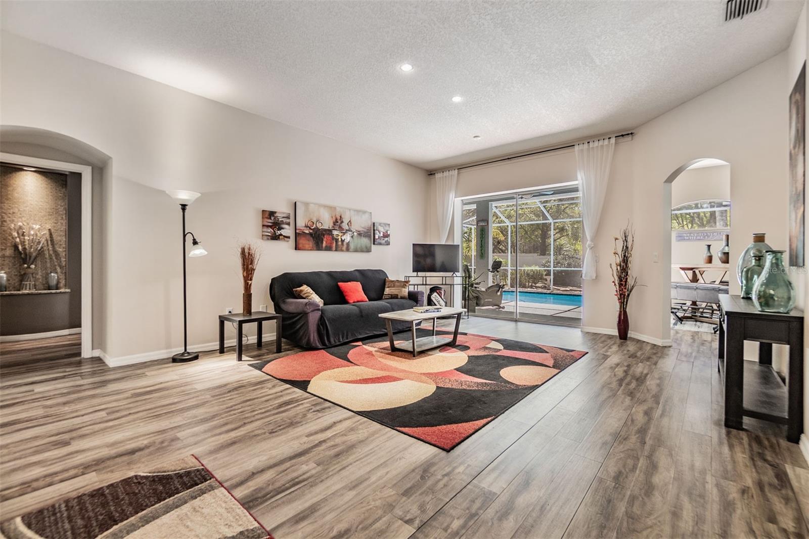 Formal Living Room, Laminate Flooring open to the pool/lanai.