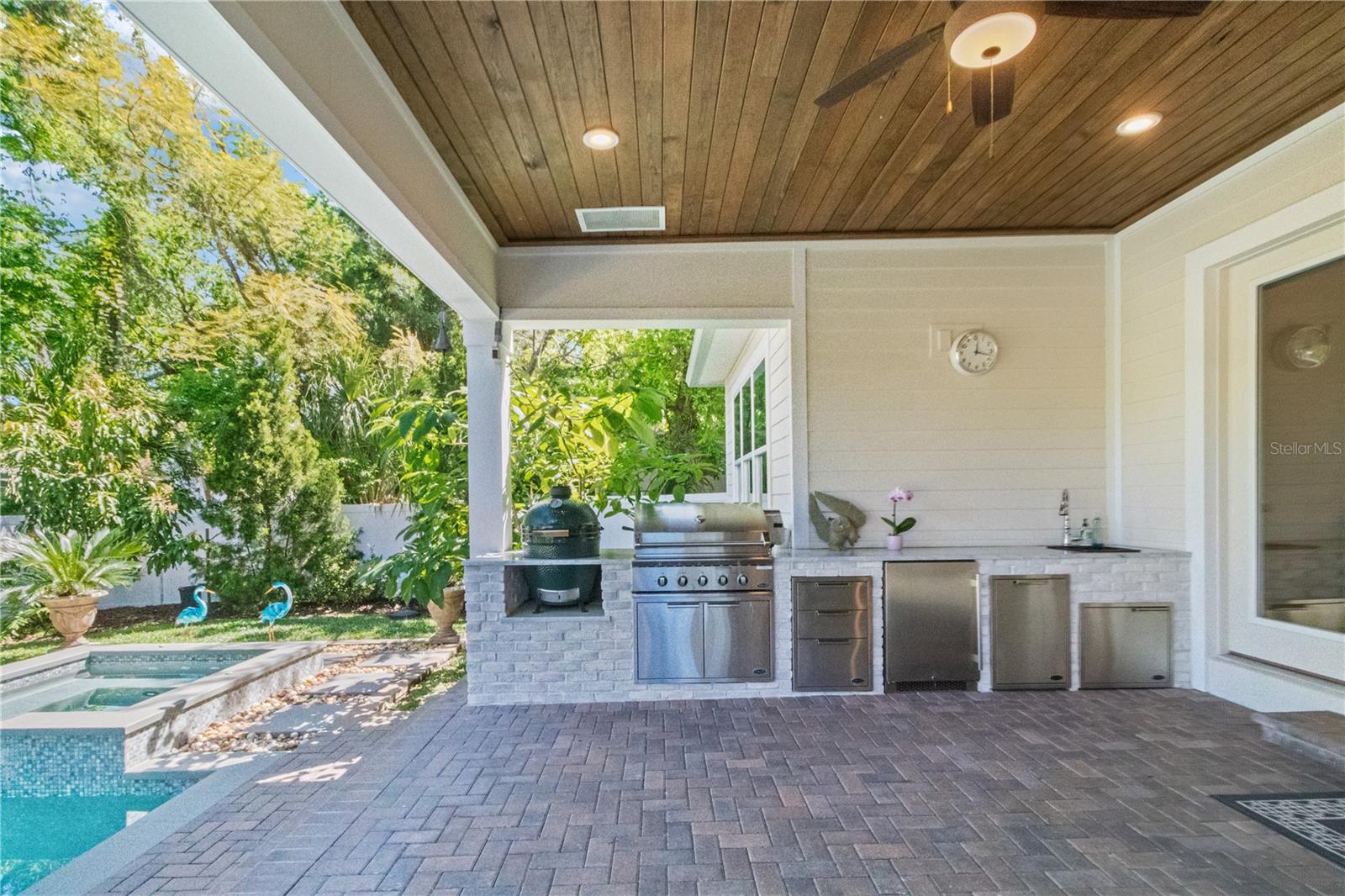 back patio with outdoor kitchen