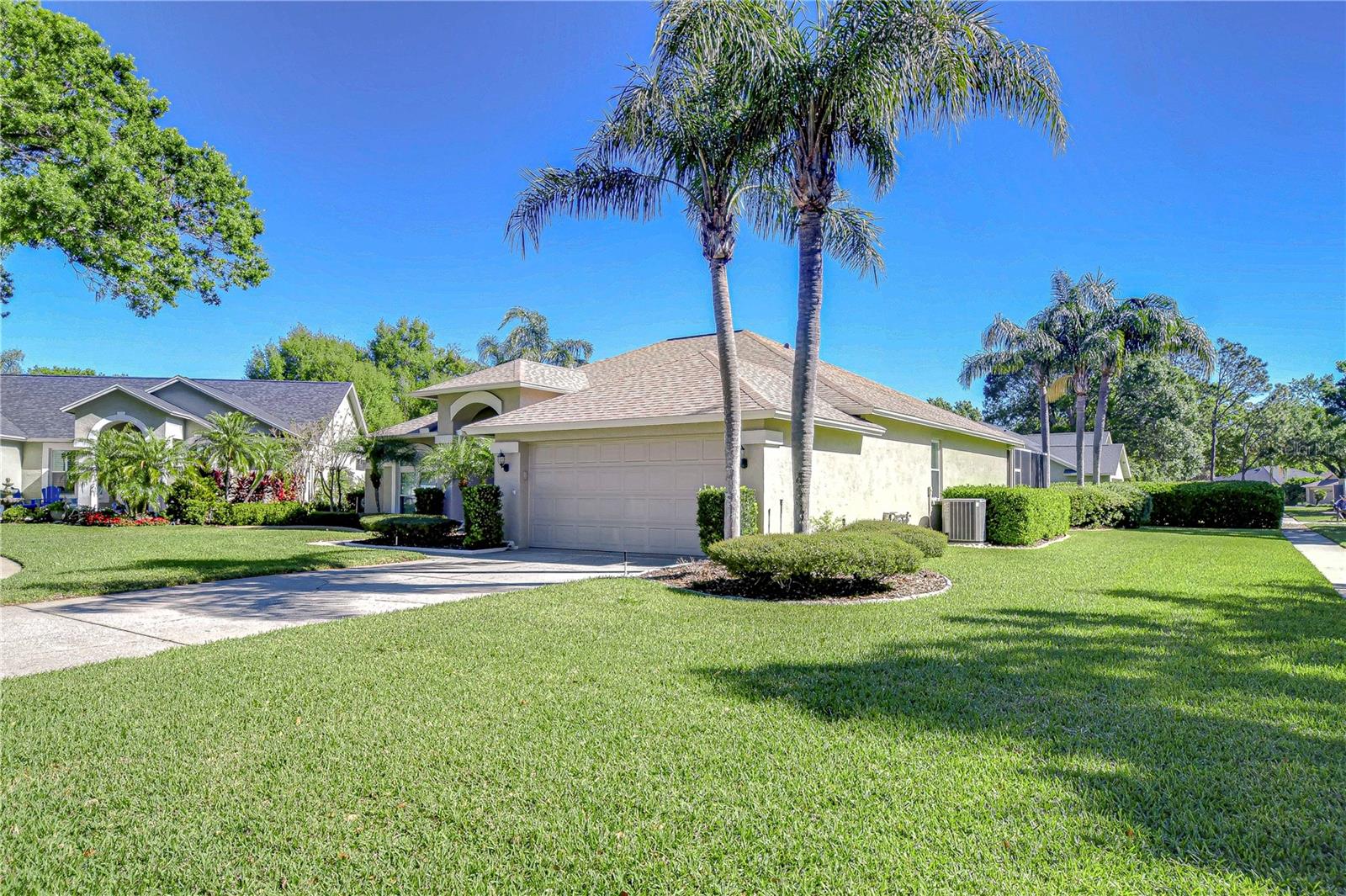 Nestled amidst lush greenery and swaying palm trees, this inviting residence offers a perfect blend of comfort and style.